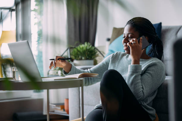 istock Women in Business: Beautiful Businesswoman Using a Laptop while Working from Home 1339901468