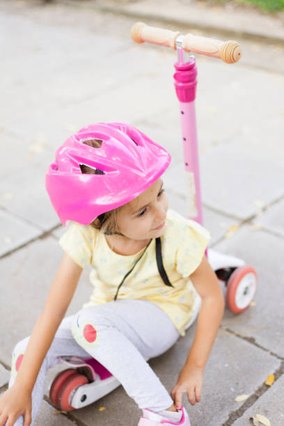 istock girl with push scooter 1339902688