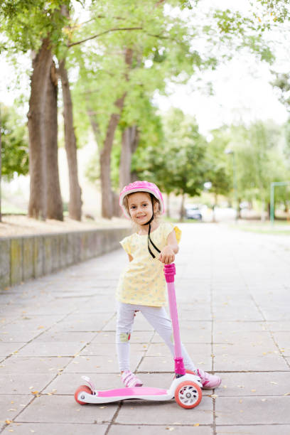 istock girl with push scooter 1339902833