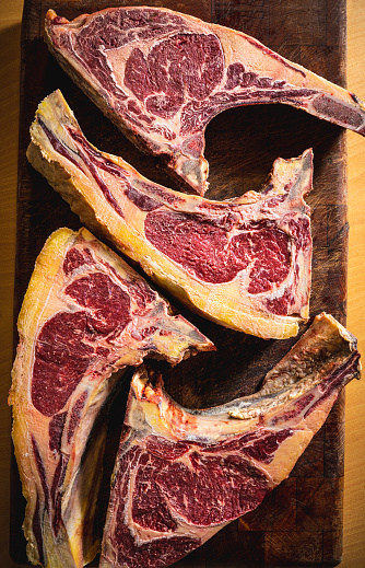 Four dry aged beef veal steak fillets of meat, dry-aged in hot box refrigerator for months