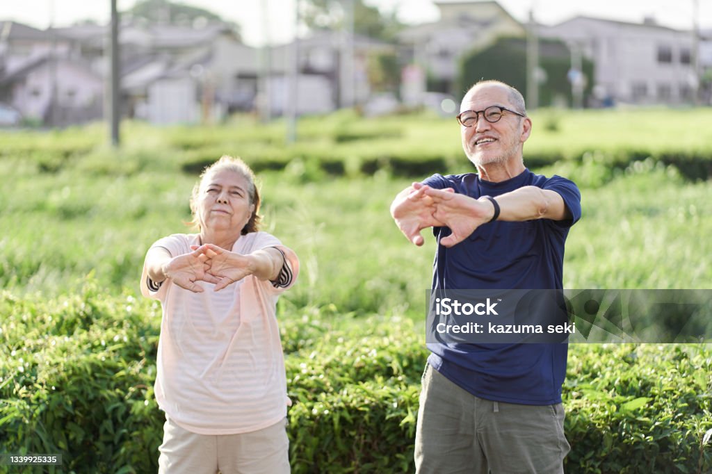 Elderly people doing preparatory exercises outside Senior Adult Stock Photo