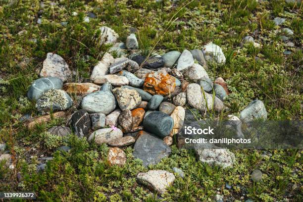 Pile Of Stones With Lichen And Moss On Green Grass Art Nature Background With Many Stones On Ground Altai Pagan Cemetery Ancient Pagan Burial Place Of Altaians Pagan Rite On Altai Heap Of Stones Stock Photo - Download Image Now