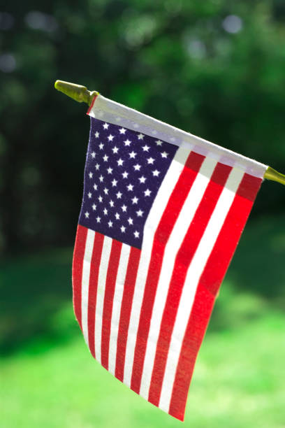 istock American Flag outside on a beautiful sunny day.  Reverse side. 1339927440