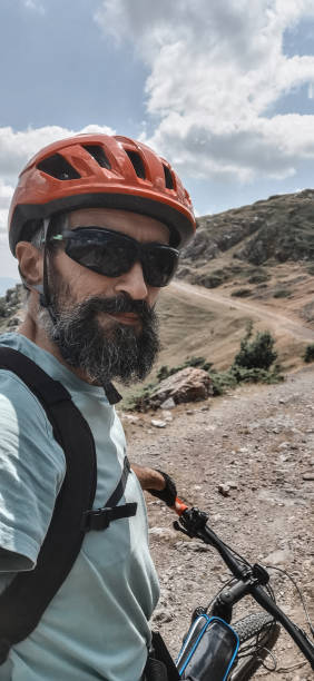 istock Mountain biker vlogging on a bicycle trail. 1339927782