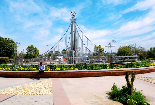 March, 2020 : a boy sitting and using a mobile at pushpa gujral science city, punjab