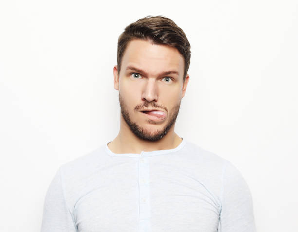 istock portrait of a young man surprised face expression 1339938609