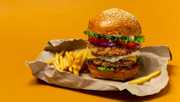istock Big chicken doubleburger with fries 1339939885