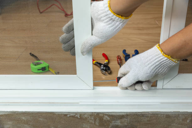 istock Worker fixing the insect screen sliding door 1339942173