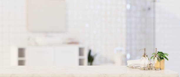 istock Foreground for montage product display on marble tabletop over blurred bathroom, bathroom, 3d rendering 1339943270