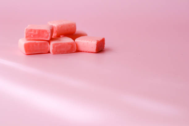 istock Sticky pink candy on pink background 1339944241