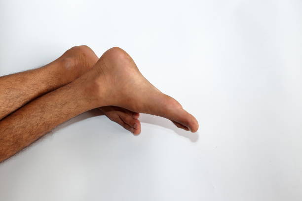 istock A man sleeping barefoot on the floor 1339946345