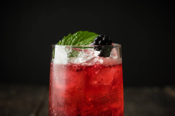 istock Blackberry cocktail with crushed ice on the rustic wooden background. Selective focus. Shallow depth of field. 1339955338