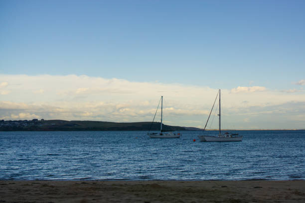 istock Two white boats on blue sea 1339956085