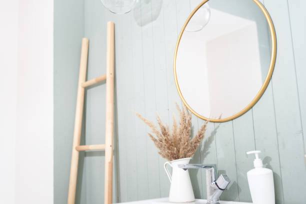 istock A modern bathroom interior with a minimalist decor, a sink and a round mirror in a stylish bathroom. Interior design 1339960192