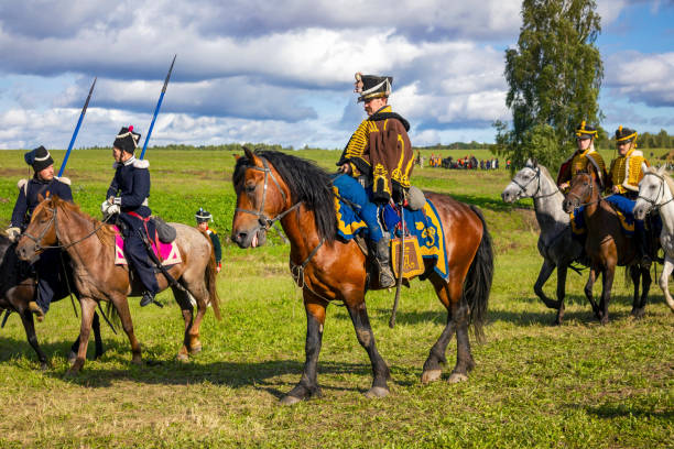 The Borodino battle reenactment. Participants in Imperial Russia uniforms of soldiers, officers, generals riding horses. Borodino, Moscow Region, Russia - September 05, 2021: The Borodino battle reenactment. Participants in Imperial Russia uniforms of soldiers, officers, generals riding horses. historical reenactment stock pictures, royalty-free photos & images