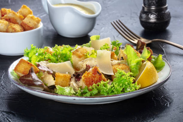 istock Chicken Caesar salad with the classic mayonnaise based sauce and croutons 1339967216
