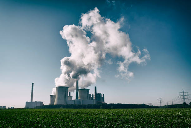 istock Toned photograph of a coal fired power plant with pollution 1339969821