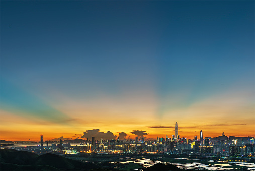 v-shaped anti-crepuscular ray over Shenzhen city during sunset, viewed from Hong Kong border