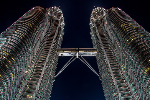 Petronas towers in Malaysia, Kuala Lumpur at night with dark sky
