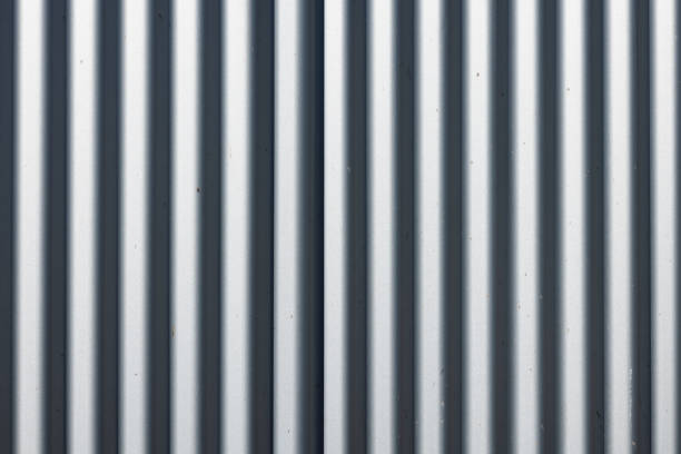 Corrugated iron fence detail on a sunny day.