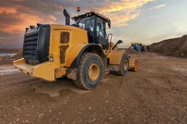 istock Excavator moving dirt and sand at a construction site 1339979231