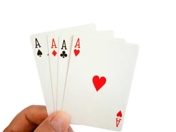 A man is holding of four aces cards, isolated on white background