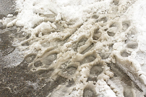 A street covered with snow slush.http://tools.stock-board.info/lightboxes/image-aa8e5a86f6cf5dfc371d187ce7adca8e.png