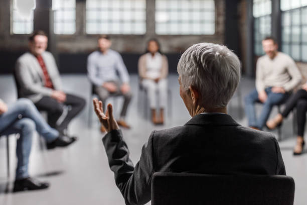 istock Rear view of a psychologist talking on a group therapy. 1339981914