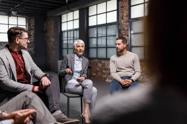 istock Senior businesswoman leading a group therapy. 1339982549
