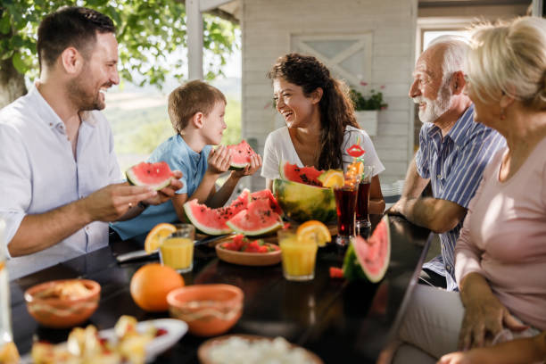 istock Happy extended family enjoying while talking on a patio. 1339984585