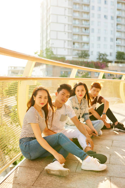 istock Young People Sitting on Brige 1339989773