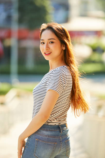 istock Young Woman Smiling at Camera 1339989785