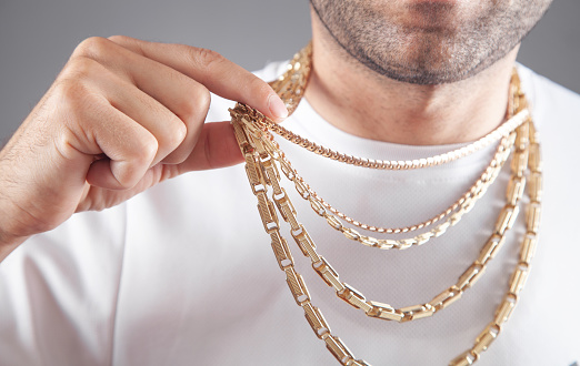 Man with a expensive necklace. Fashion accessories and jewelry
