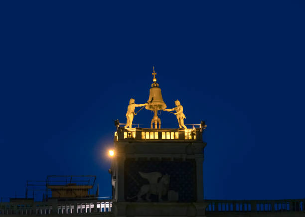 Venice, Clock and bell tower in Renaissance style in San Marco square with the statues called Mori di Venezia, UNESCO world heritage site, Venice, Italy