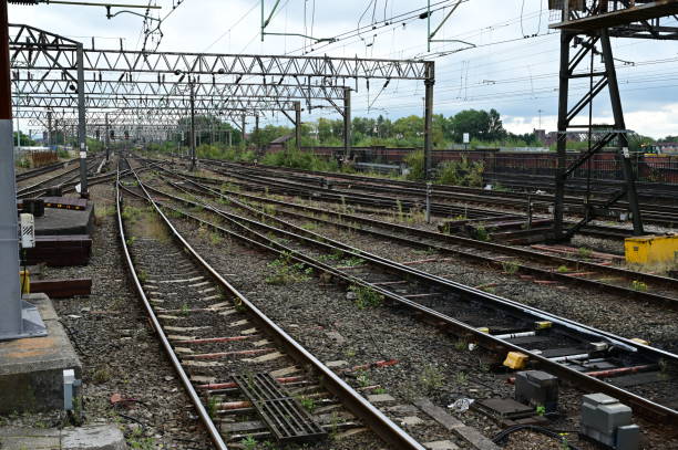 istock Train tracks with Catenaries for electric trains. 1339992894