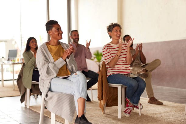 istock Public clapping at the end of a speech. 1339993892