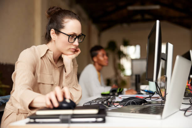 istock A businesswoman using a computer mouse in an office. 1339993924