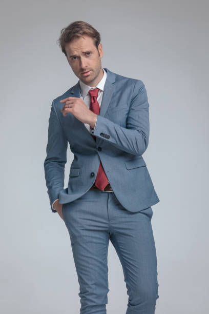 istock sexy businessman posing with one arm folded 1339994228
