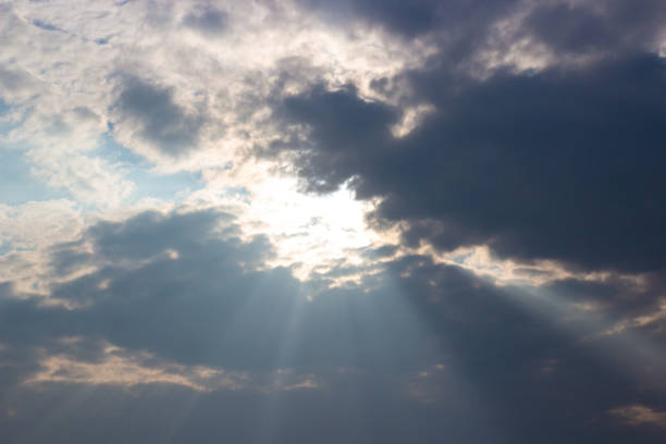 istock Sunlight through cloudy sky. Holy Light comes from heaven. 1339994266