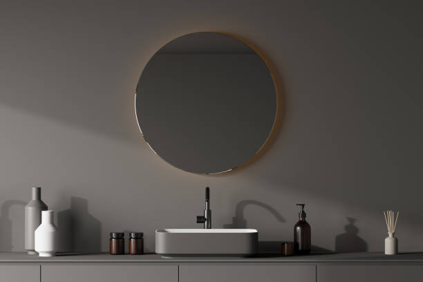 istock View of grey bathroom sink with round mirror 1339996060