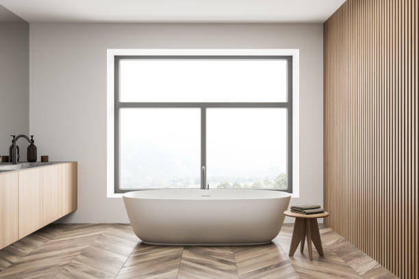 istock Bathroom interior with white bathtub, mirror and sink 1339996102