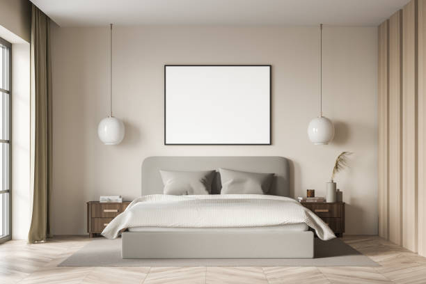 istock Bright bedroom interior with empty white poster and large bed 1339996246