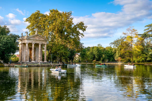 A delicate scene in pastel colors on the lake of Villa Borghese in the heart of the main park of Rome stock photo