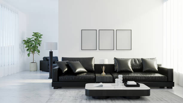 istock blank frames mock up in modern living room interior with black leather sofa, white empty wall, scandinavian style, 3d rendering 1340000582