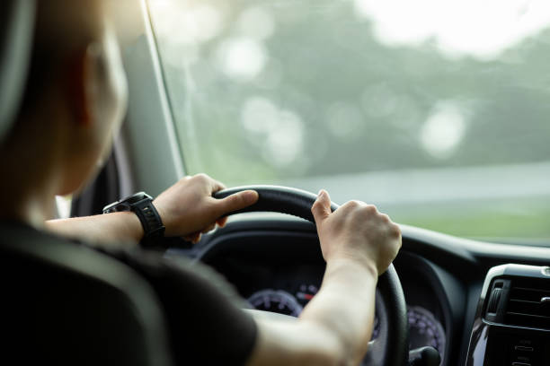 istock People driving car on sunrise mountain road 1340000866