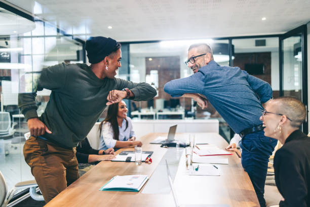 istock Smiling businessmen elbow bumping each other before a meeting 1340004001