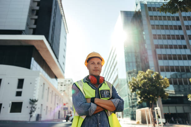 istock Self-confident construction worker standing with his arms crossed 1340004321