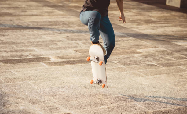 istock Skateboarder skateboarding outdoors in city 1340004347