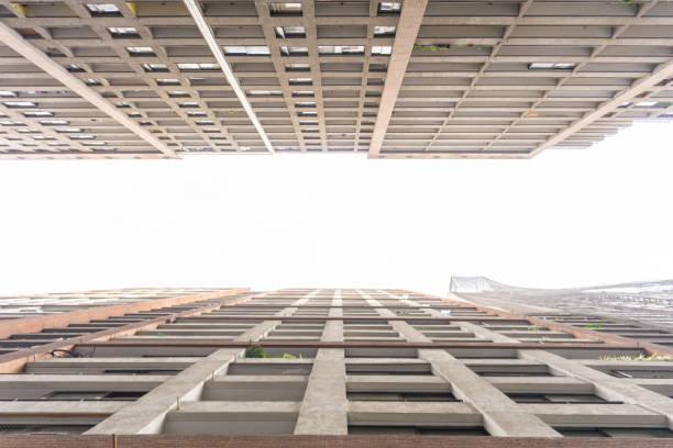 istock Looking up at the building on a cloudy day 1340004441