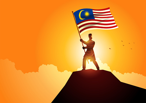 Vector illustration of a man in malay traditional costume holding the flag of Malaysia on mountain peak